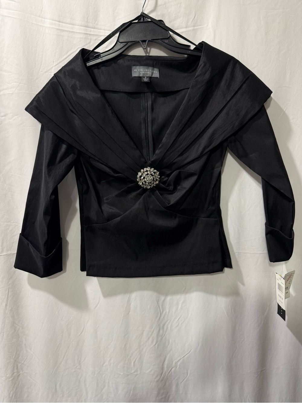 Carlisle Black V-Neck Draped Blouse with Decorative Brooch